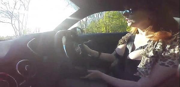  British mature Red fingers her cunt in the car again